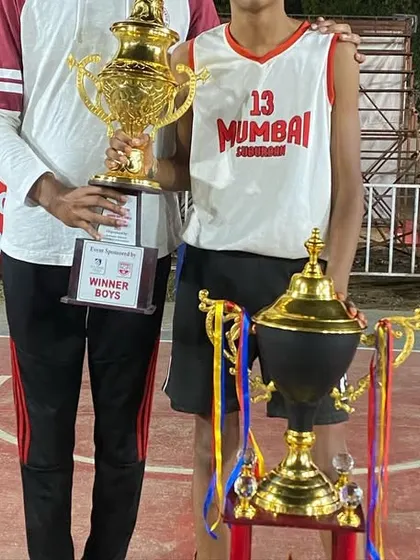 Jordan holding the winner's trophy at the U13 state championship. This was his third major trophy in a month across three different sports.