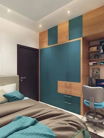 A compact bedroom that includes a wardrobe with an attached study desk. The teal and wood two-tone finish adds a pop of color and personality to the room.