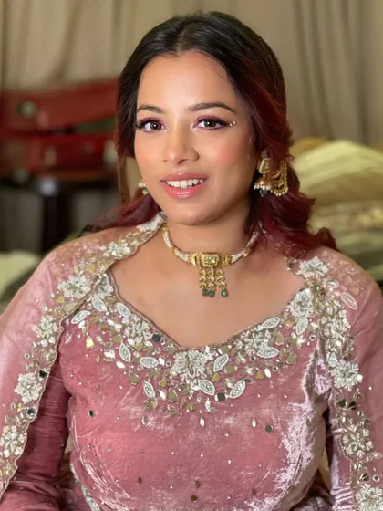 Gorgeous is an understatement. This client's pink velvet outfit is paired with a beautiful pink eyeshadow and a touch of sparkle.