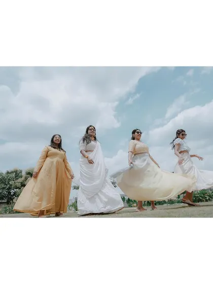 A beautiful shot of the bride and her bridesmaids, their dresses flowing in the wind.