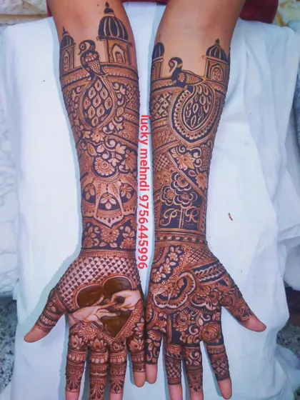 A beautiful engagement design with a heart-shaped frame around a couple's portrait on one hand, and peacocks on the other.