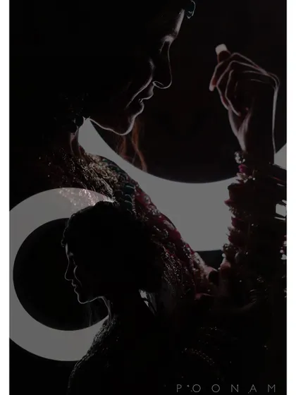 A creative silhouette portrait of a bride, using shadows and light to create an artistic and mysterious image. The graphic elements add a modern design touch.
