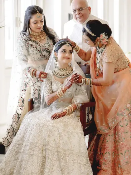 The bride being blessed and adorned by the women in her family. A beautiful portrait of love spanning generations.