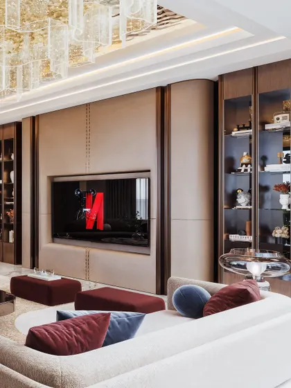 This angle shows the custom TV unit with stitched leather-like paneling and integrated display shelves. The lighting simulation emphasizes the warm, inviting glow within the cabinetry.