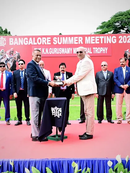 Mr. K.N. Tilak Kumar presents The K.N. Guruswamy Memorial Trophy to the owners of Crosswater.