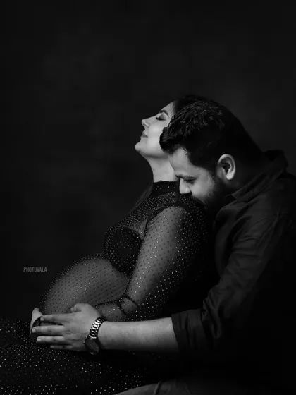 The quiet connection between a couple before their family grows. This intimate black and white portrait captures a moment of peace and shared love during a maternity session.
