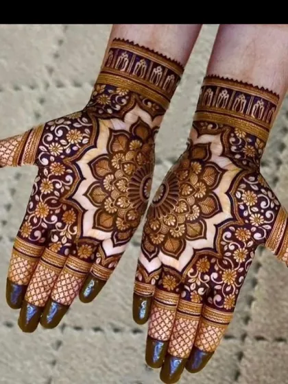 The stained result of a heavy mandala design. The dark maroon color shows the quality of my natural henna paste. Notice how the central mandala is surrounded by delicate floral work.