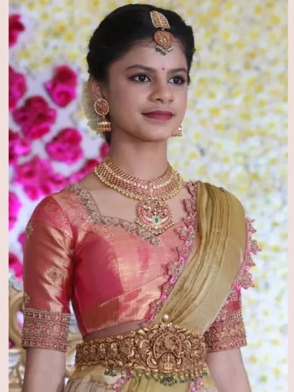 A young client looking graceful in a bejeweled raw silk blouse for a special occasion.