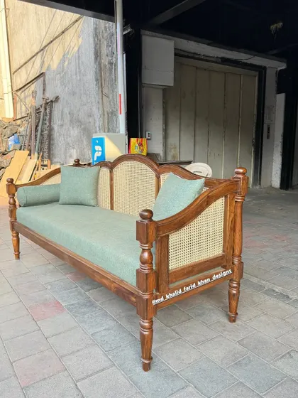 Another angle of the teak and cane daybed, ready for delivery.