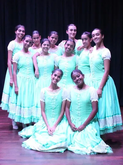 A moment of togetherness after a performance. The bond between our dancers is a huge part of our strength as a company.