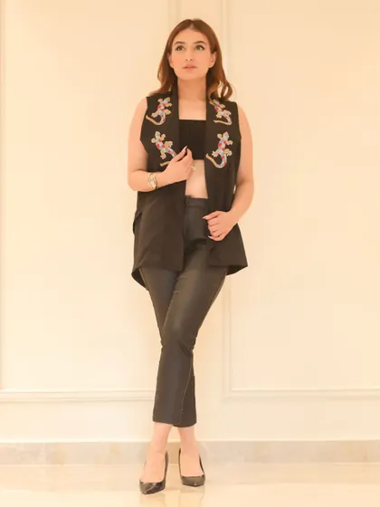 A full-length shot of the black vest outfit, providing a complete view of the ensemble for an e-commerce fashion listing.