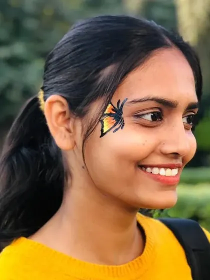 A fiery butterfly design with shades of orange and yellow, perfect for a bright, sunny day.