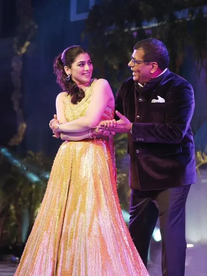 A heartwarming father-daughter dance during the Sangeet. These emotional moments are just as important as the high-energy performances.