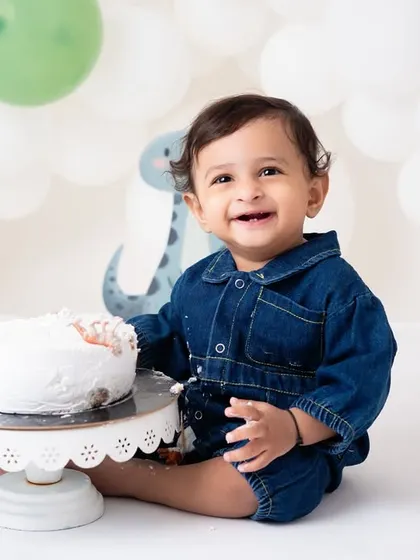 This little one, surrounded by a cute jungle theme, is all smiles with his birthday cake. I work with you to create a setup that you'll love, ensuring the photos are personal and special.