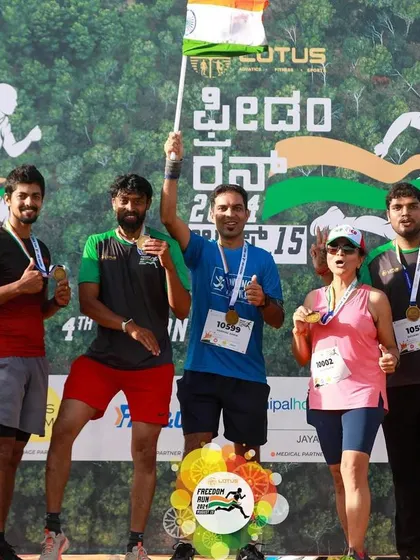 The Running Roadies crew poses for a group photo after the Freedom Run. Our events are powered by the energy of local running clubs and communities.