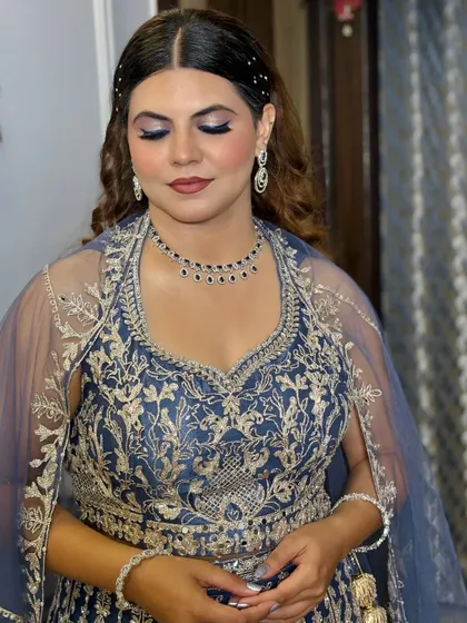 Another shot of the blue-themed makeup, showing the shimmer and glitter details on the eyelid.