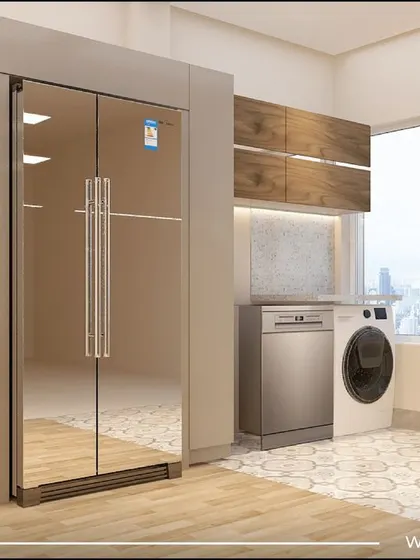 The utility area adjacent to the kitchen in our 'Sobha Daisy' project. It features a large side-by-side refrigerator, a dedicated space for the washing machine and dishwasher, and ample storage.