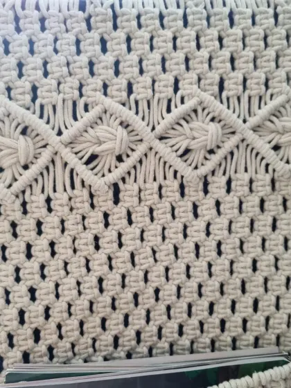 A top-down view of the wall pocket, highlighting the beautiful diamond-patterned knots at the top. Every part of the piece is designed with care.