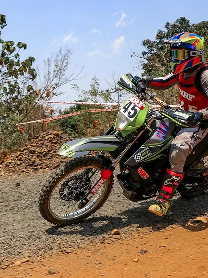 Riding the rally-spec KTM Adventure 390 on a gravel path. This machine was specially prepared by Race Concepts to handle the grueling conditions of the Indian National Rally Championship (INRC).