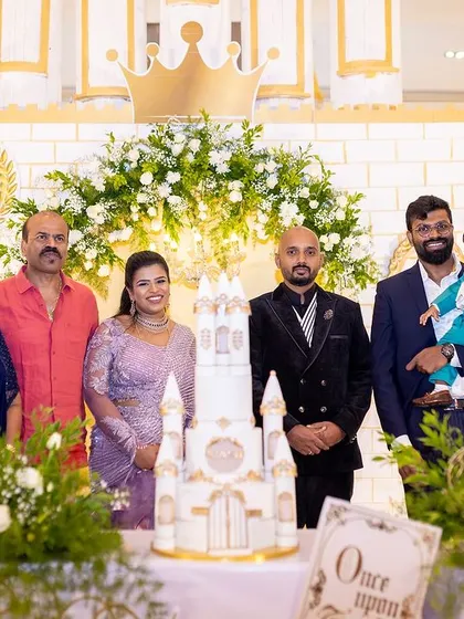 A group photo capturing the joy of the family celebrating a first birthday. Our setups are designed to be the perfect backdrop for both grand entrances and treasured family portraits.