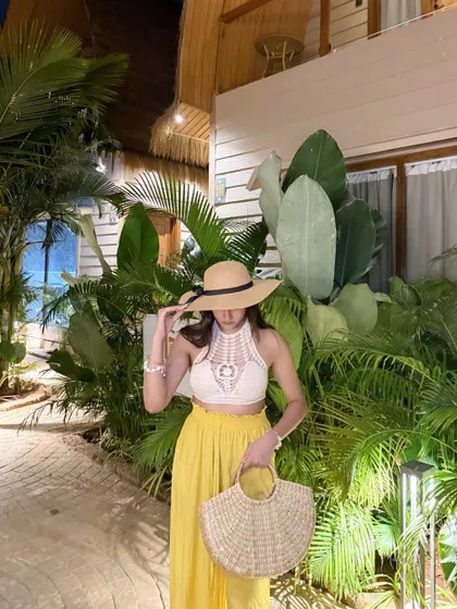 Adjusting my hat, a classic vacation pose.