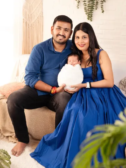 A new family of three. A classic portrait capturing the joy and completeness a newborn brings.