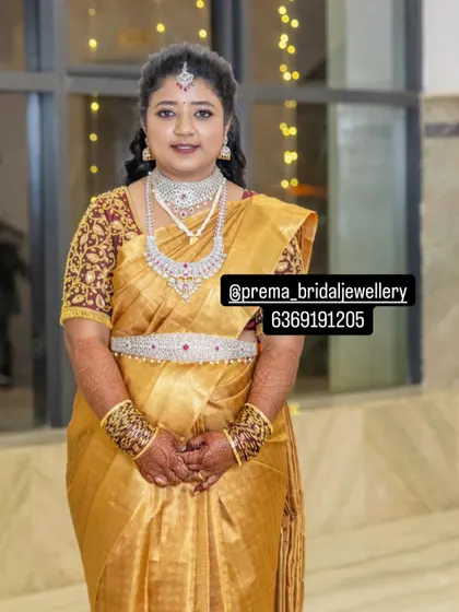 This bride is wearing a beautiful AD set with ruby accents for her reception.
