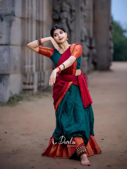 A collection of poses from a cherished photoshoot. The combination of the traditional half-saree and the rustic temple background creates a timeless and elegant look.