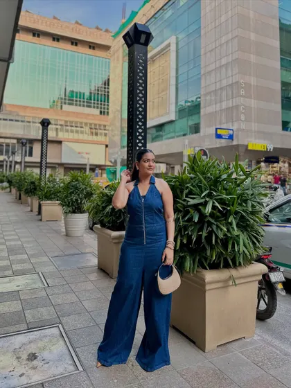 A final look at this chic denim jumpsuit, a standout piece for any casual wardrobe.