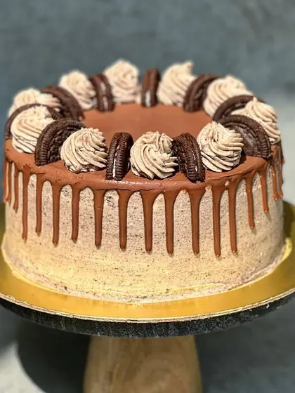 For the cookie lover, I present the 'Cookie Monster' cake. It's a vanilla Oreo cake with Oreo cream filling, an Oreo buttercream frosting, and a decadent chocolate drip.
