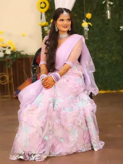 A full-length view of the bride's beautiful pastel lehenga for her sangeet.