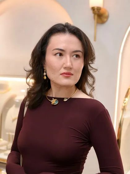 A client looks elegant wearing one of our choker necklaces. Our team is always on hand to help you find pieces that enhance your look with effortless sophistication.