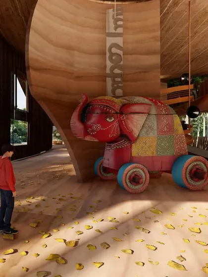 We incorporated playful elements like this large, colorful elephant toy to make the Pavilion engaging for all visitors, including children. It adds a touch of local craft and storytelling to the otherwise minimalist, material-driven interior.
