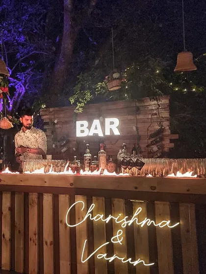 A close-up of our signature fire bar effect. This controlled line of fire along the bar counter creates an incredible visual, especially at night, and is a guaranteed showstopper for any wedding or party.