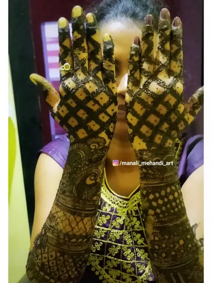 The back of the hands covered in a bold, checkered pattern. This creates a striking 'jaal' or net effect that is both traditional and eye-catching.