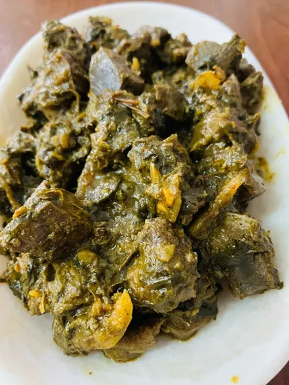 A close-up of the beef liver pickle, showing the texture of the liver and the thick, flavourful gravy it's cooked in.