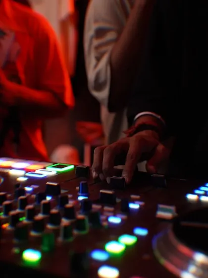 A close-up of my hand on the mixer during the Slw Drift party. Every adjustment is about fine-tuning the vibe for the crowd.
