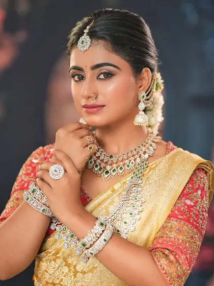 A portrait of the bride, highlighting the flawless makeup and the sparkle of her diamond jewelry. My goal is to make you feel confident and beautiful.