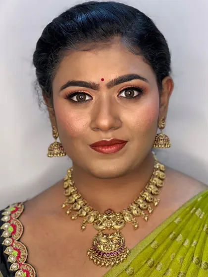 A beautiful makeover for Nikki for her housewarming ceremony. We went with warm, coppery-orange tones on the eyes and a rustic red lip to match her traditional half-saree.