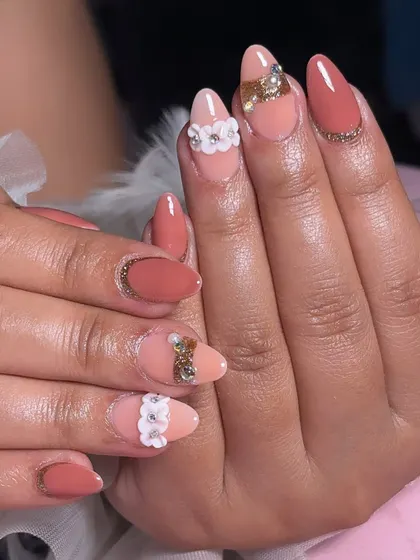 A beautiful peach-toned set with a mix of matte and glossy finishes, adorned with 3D white flowers and gold crystal accents.