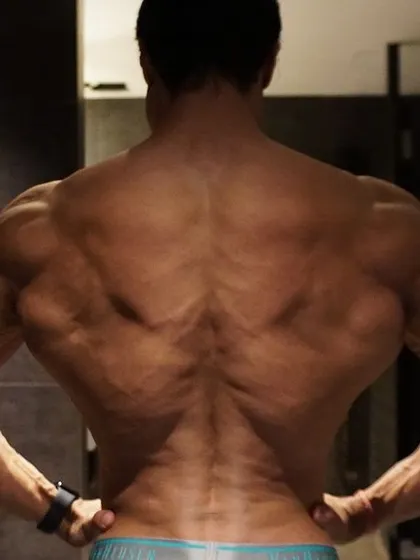 A classic back lat spread. You will be replaced if you stop working. Stay hungry.