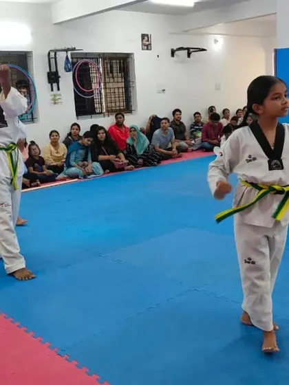 A student demonstrates a knife-hand block during her Poomsae.