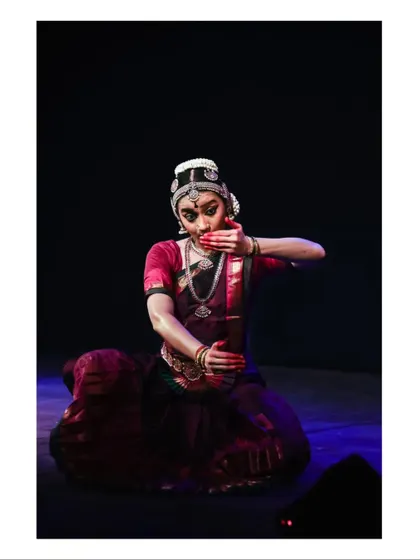 A moment of abhinaya where the Nayika is in conversation, using hand gestures and expressions to communicate her thoughts.