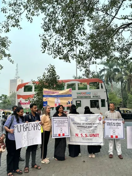 Our team, along with students from the College of Home Science's NSS unit, holding placards for our voter awareness drive. Collaboration with educational institutions is key to mobilizing the next generation of voters.