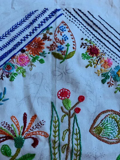 The floral hoop art is taking shape. I love combining different elements, from freestyle flowers to structured, linear patterns, to create a balanced and interesting composition.