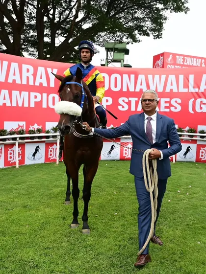Mahler, with jockey P. Trevor, is led by trainer S.S. Attaollahi after winning the memorial cup.