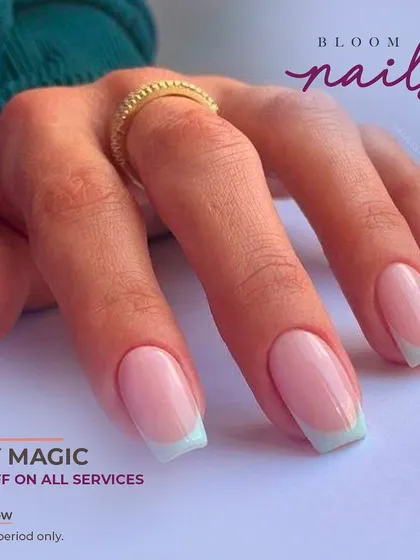 A closer look at the clean lines of this modern mint green French manicure.
