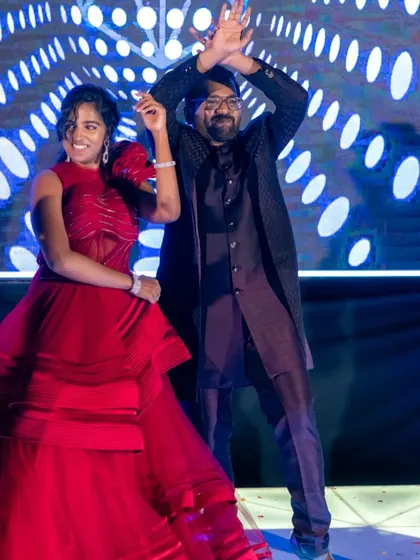 The bride, in her stunning red gown, dances with her groom. The open floor provides countless opportunities for beautiful, candid photos of the couple enjoying their night.