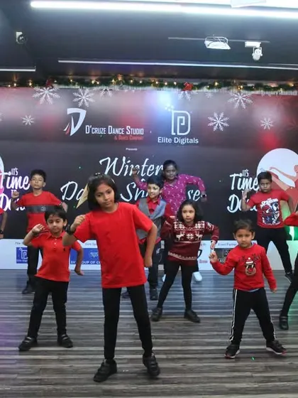 Striking a strong pose during the kids' group dance at the winter showcase.