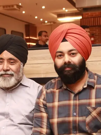 A father and son portrait of two guests at a restaurant event.